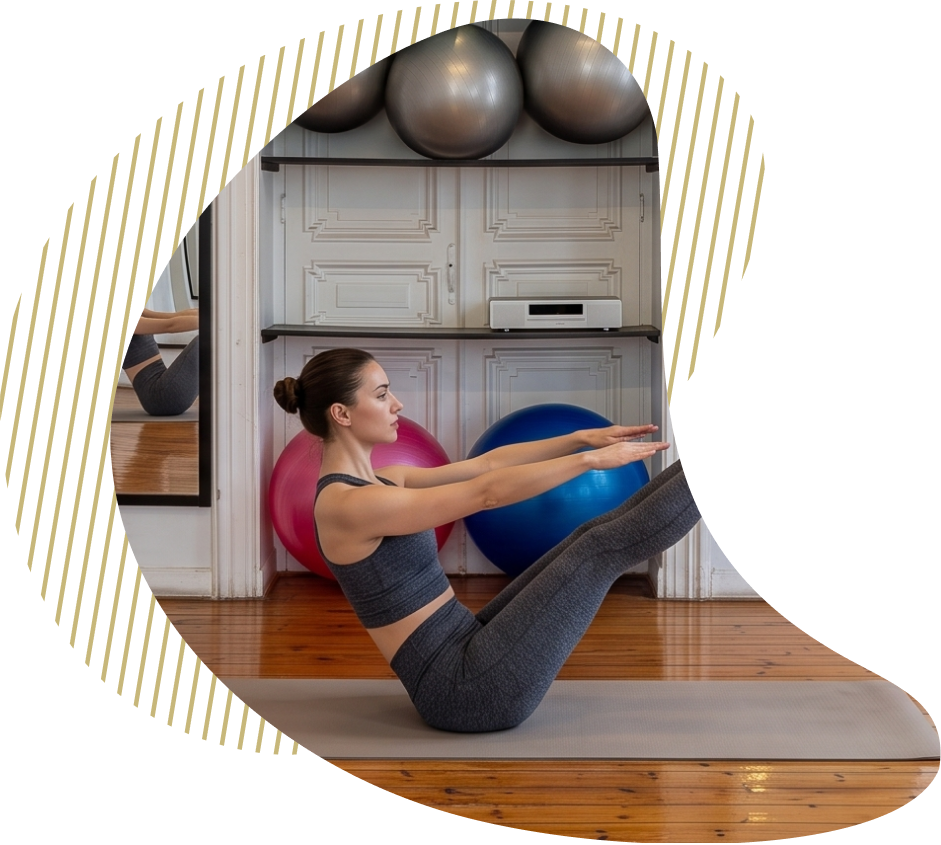 A member holding a seated balance on a mat